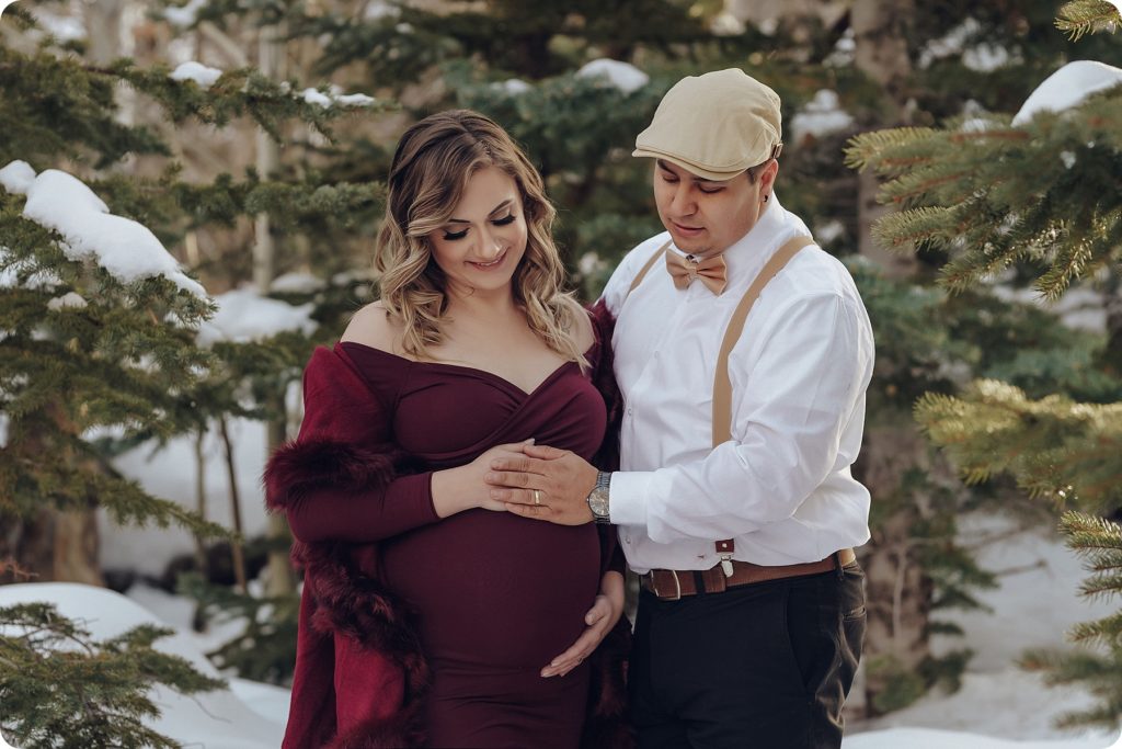 husband and wife touch belly during maternity photos by Beka Price Photography