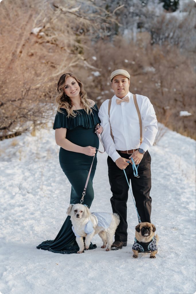 husband and wife pose with dogs during maternity photos by Beka Price Photography