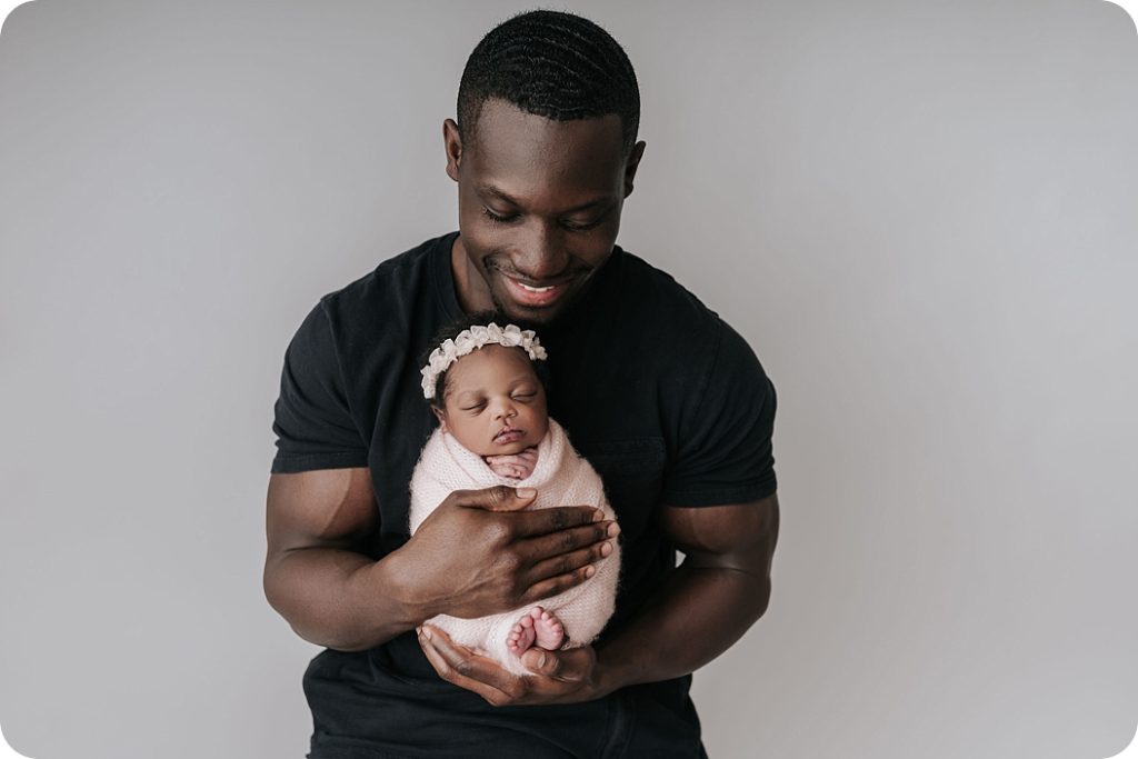 Beka Price Photography photographs father holding baby girl