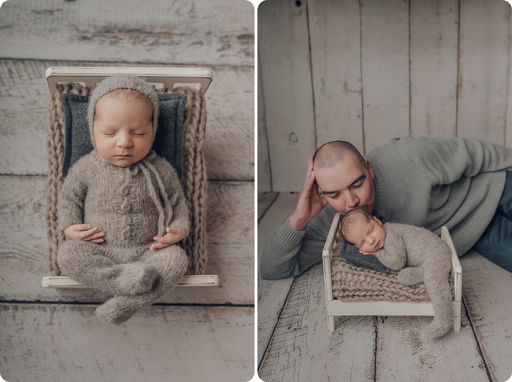 baby boy sleeps on bed while dad gives him a kiss during portraits with Beka Price Photography
