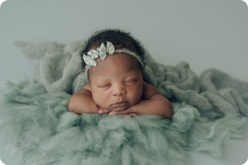 newborn baby girl lays on blanket for Beka Price Photography