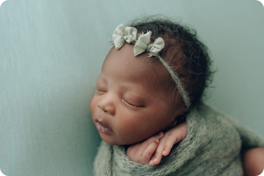 Beka Price Photography photographs baby girl with green headband