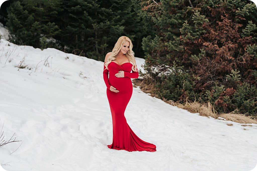 maternity session in the snow with Beka Price Photography photographs mother-to-be on mountain in the snow