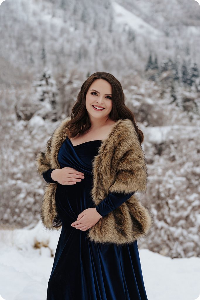 maternity session in velvet gown with furs