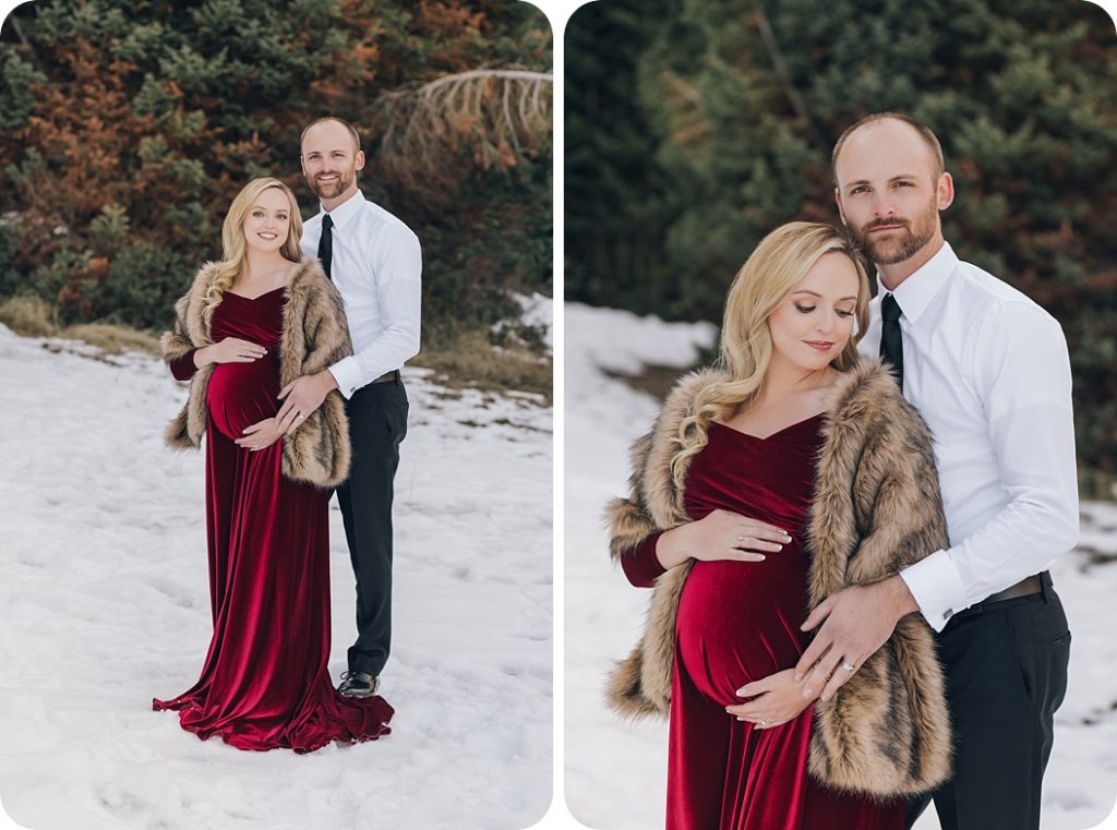 bride in red gown poses with husband during maternity portraits in the snow