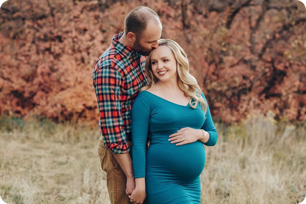 fall maternity session with mom in teal gown