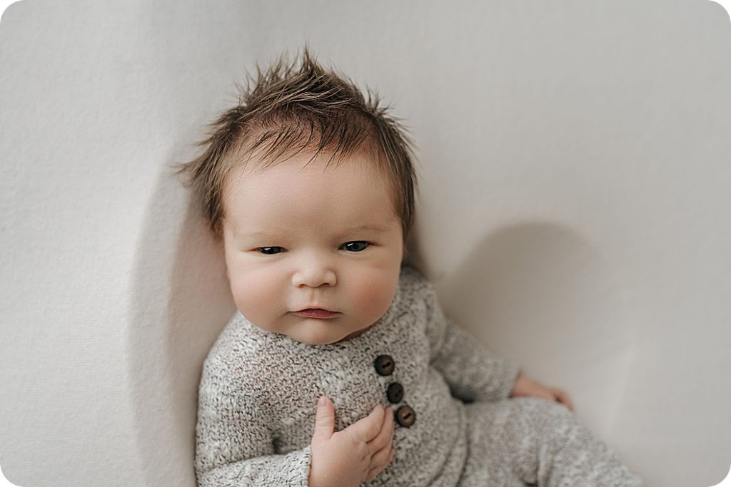 newborn baby smiles at Utah newborn photographer