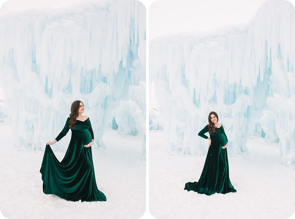 expecting mother in velvet green maternity gown holds belly during Ice Castles maternity portraits