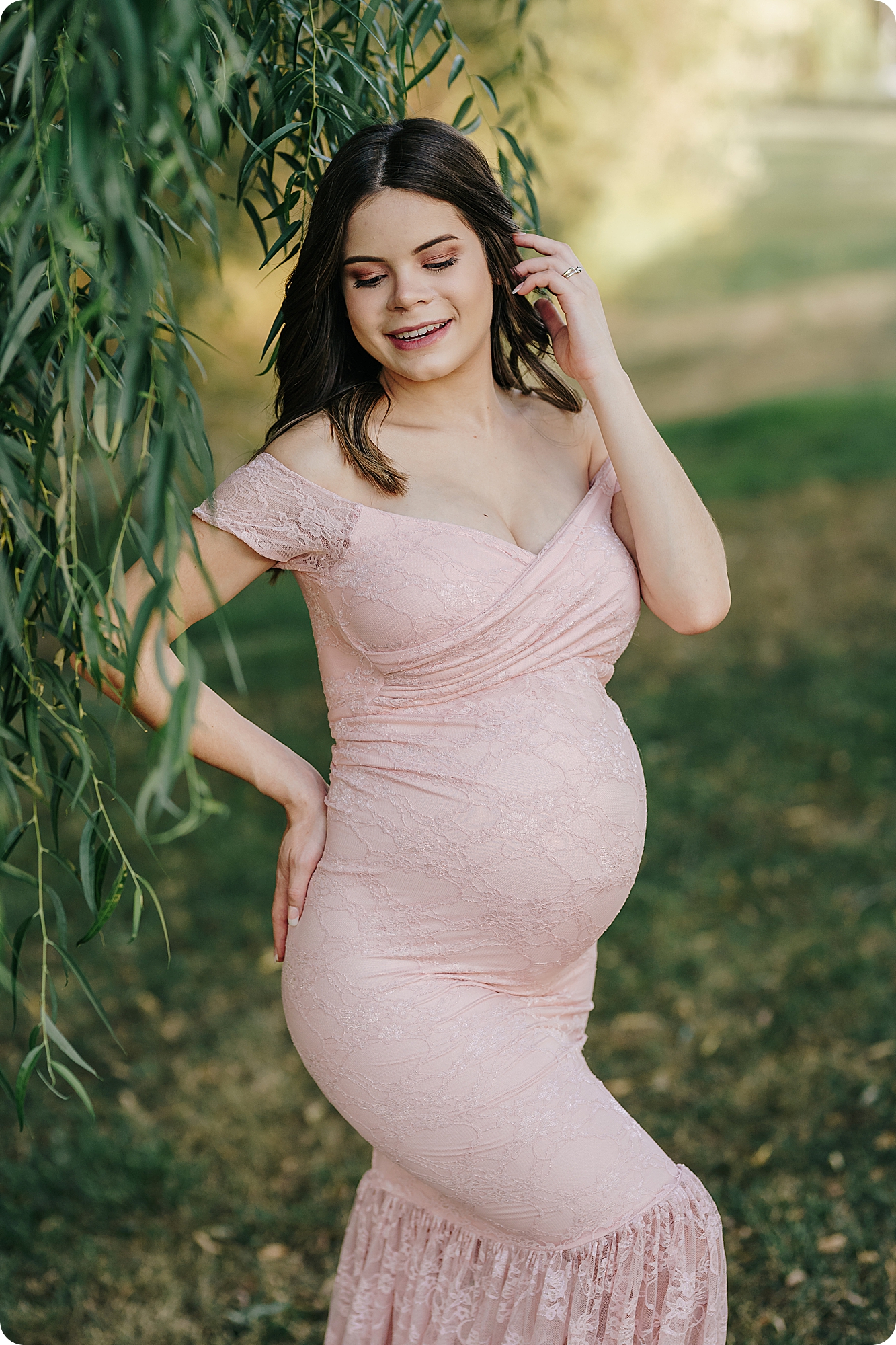 expecting mom in pink maternity gown poses during Fall Maternity Portraits in Utah