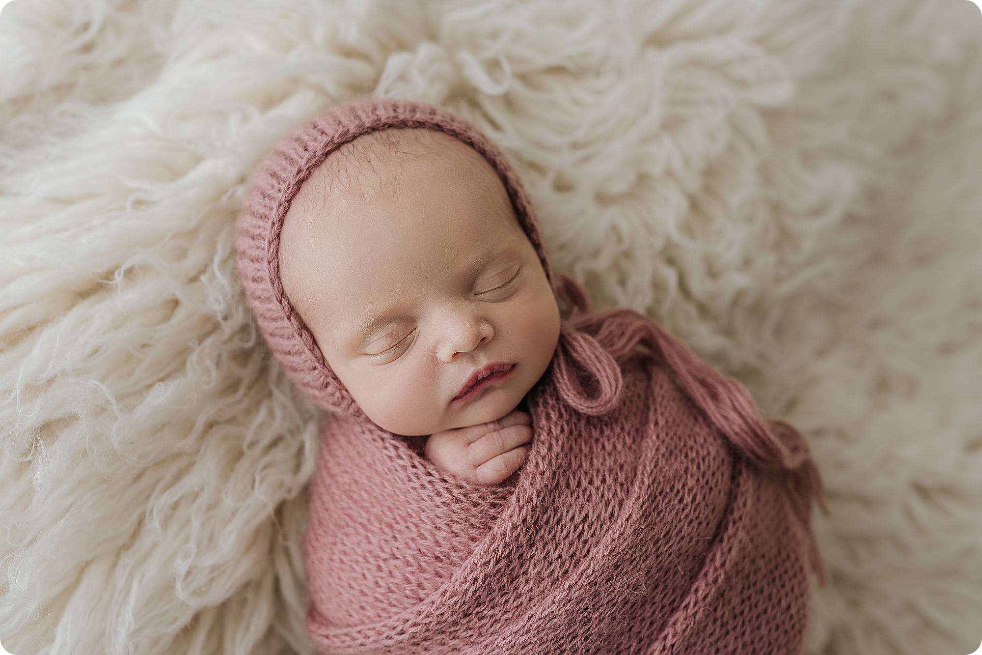 baby girl sleeps during Utah newborn session in studio 
