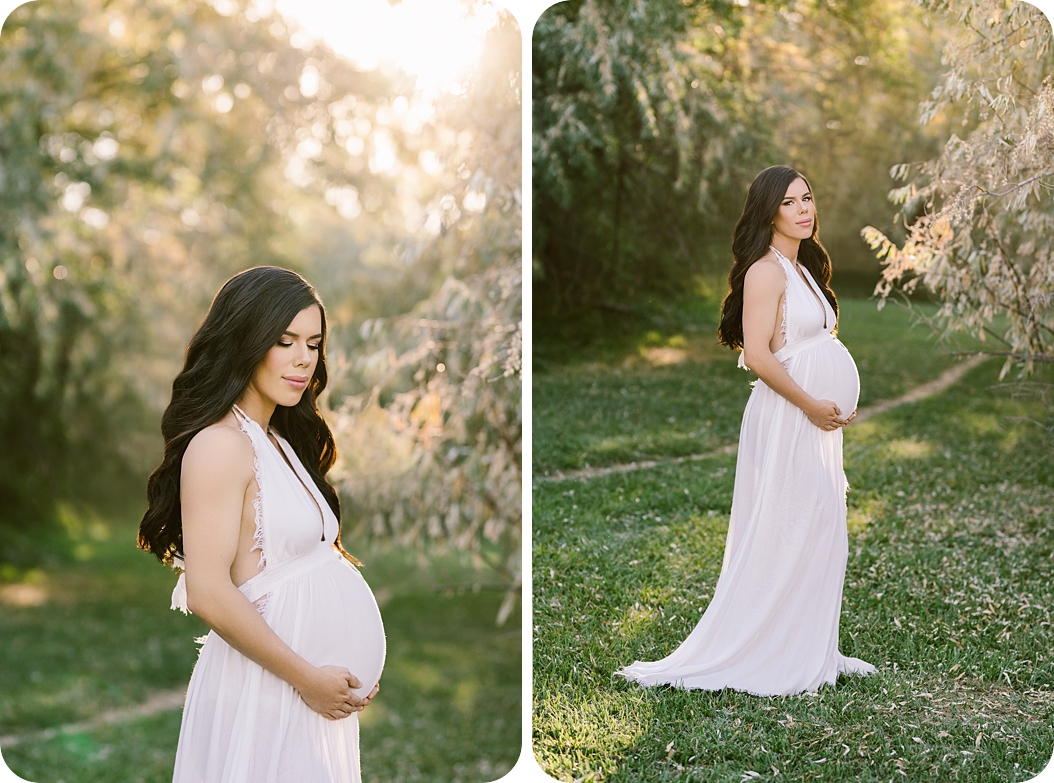 mom in white gown holds belly during Utah maternity session 