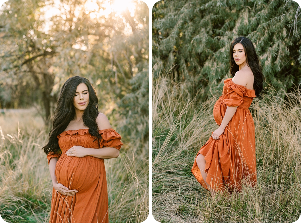 mom in burnt orange maternity gown holds belly during outdoor maternity session 