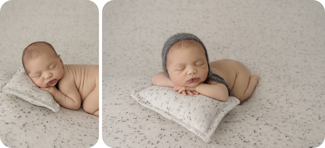 baby sleeps on speckled pillow during newborn photos in Utah studio