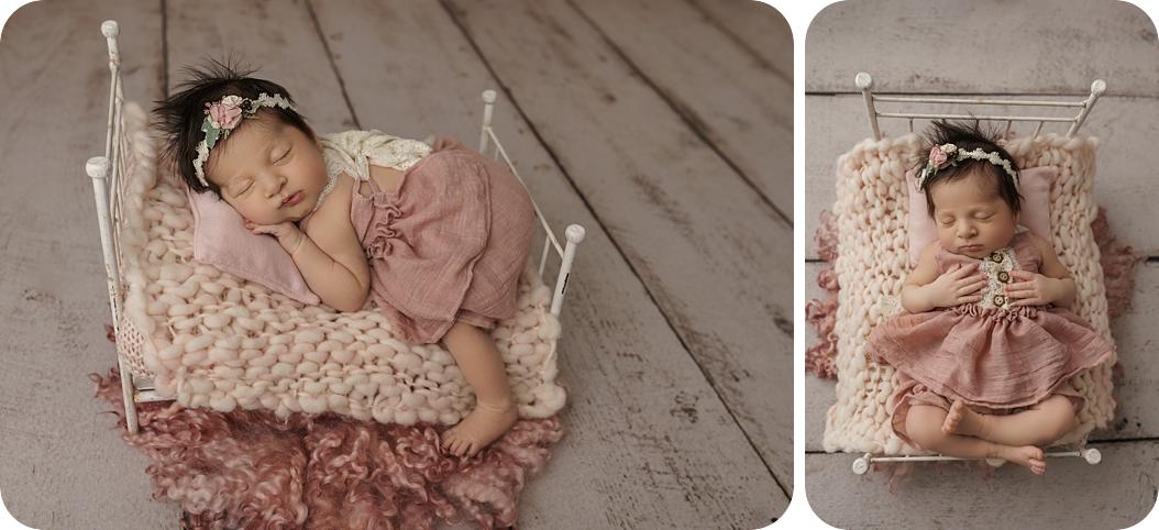 baby girl in pink dress sleeps on bed during timeless newborn portraits