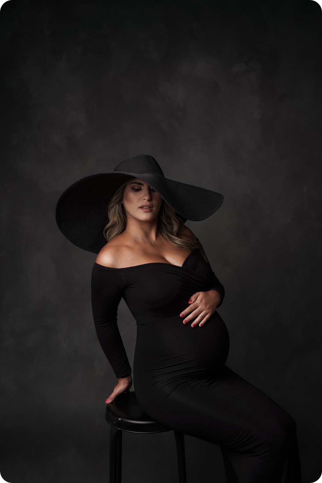 fashion Maternity Session with Sew Trendy Accessories Gowns with mother wearing big floppy black hat 
