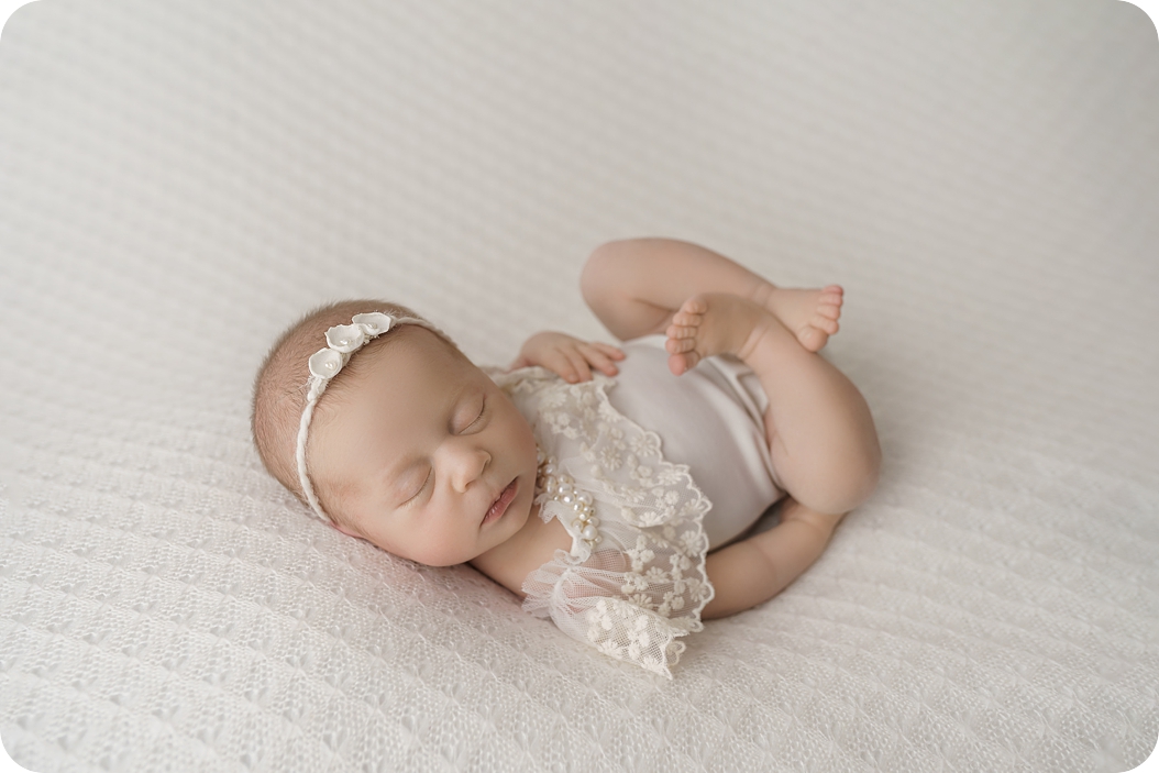 baby curl curls up sleeping during newborn photos with Beka Price Photography 
