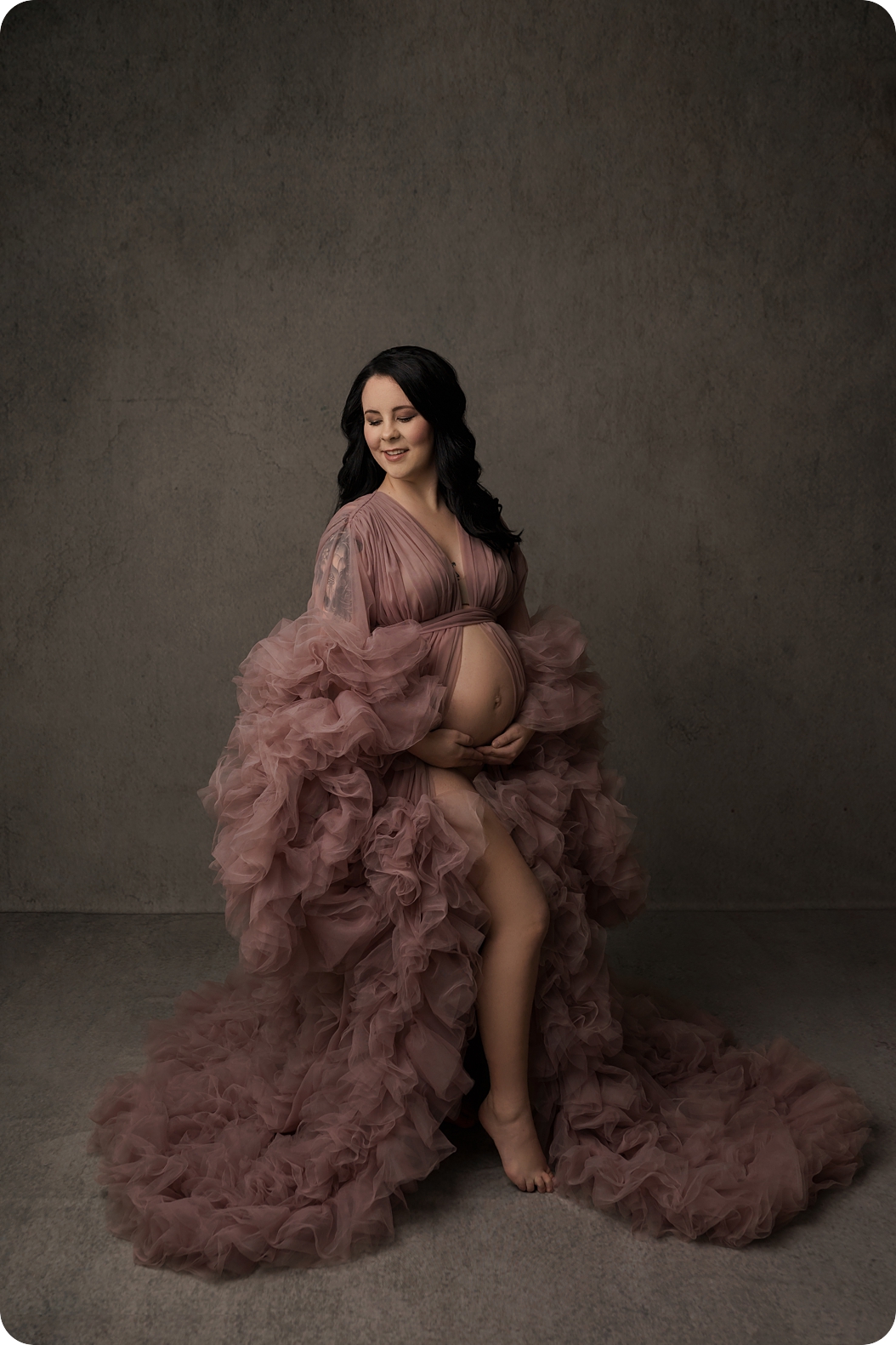mother poses in mauve couture gown during Utah maternity portraits 