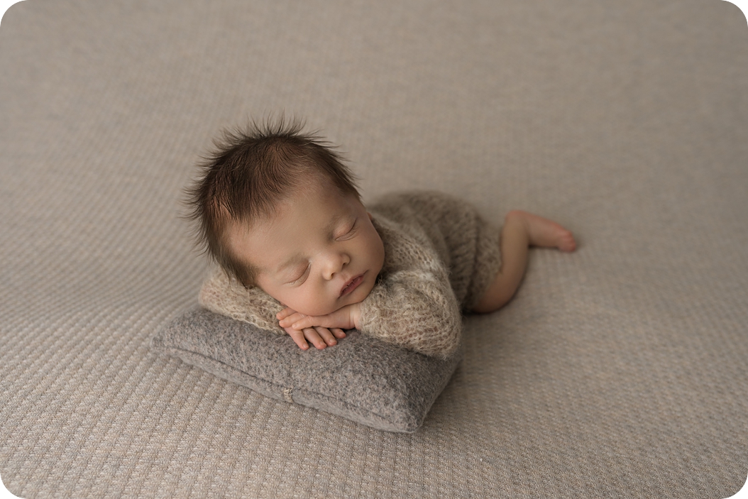 baby sleeps during newborn photos in UT studio 