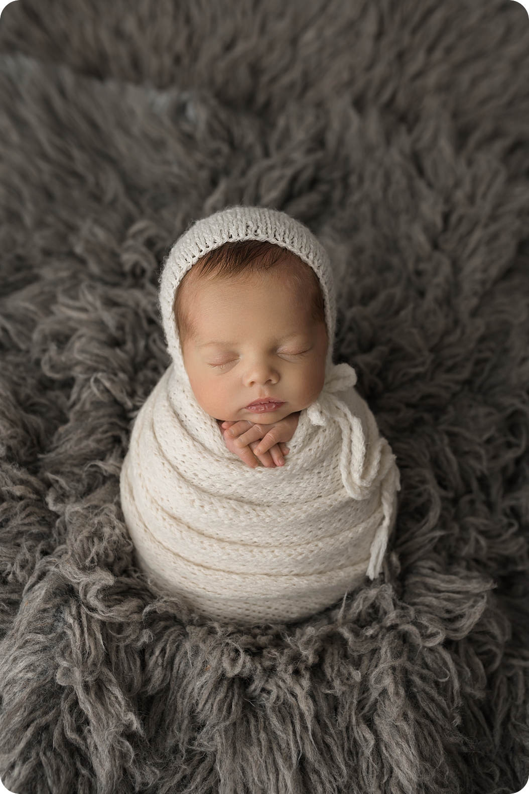 baby sleeps in white wrap during Utah newborn photos 