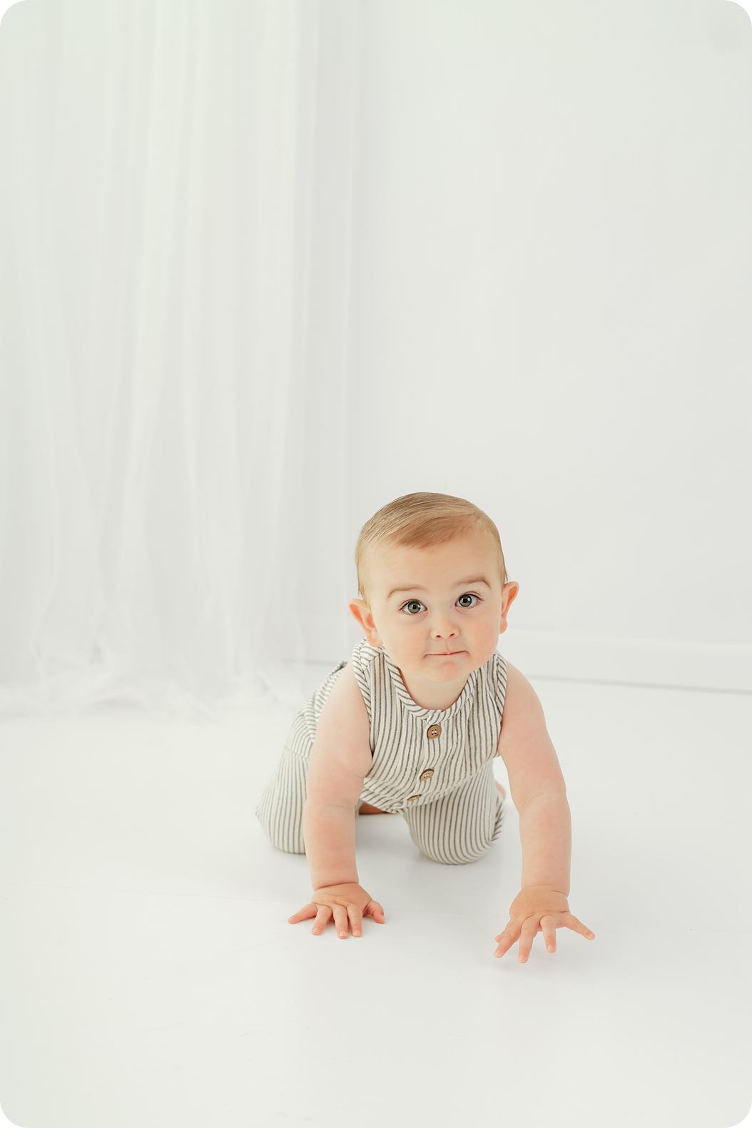 baby crawls in Utah studio during timeless first birthday portraits
