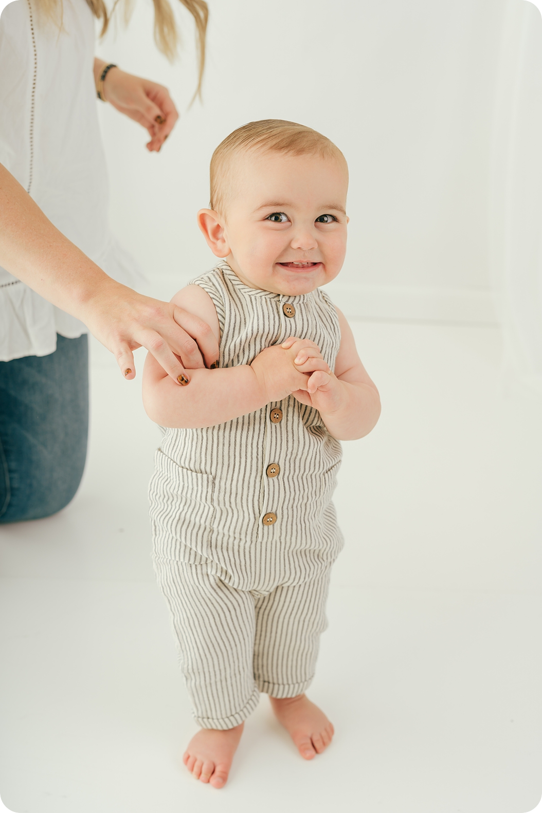 baby giggles during timeless first birthday portraits in Utah studio 