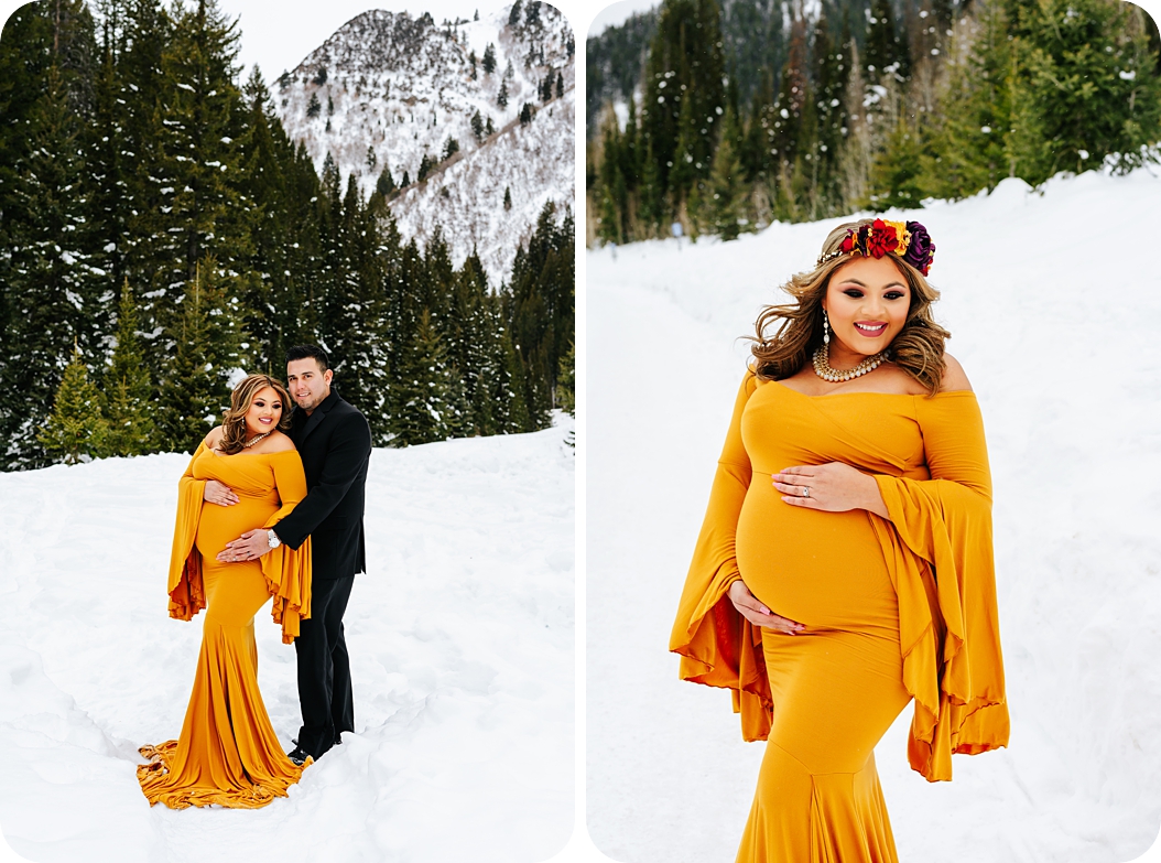 mother in mustard maternity gown with flower crown holds belly in the snow during Dramatic Winter Maternity Portraits
