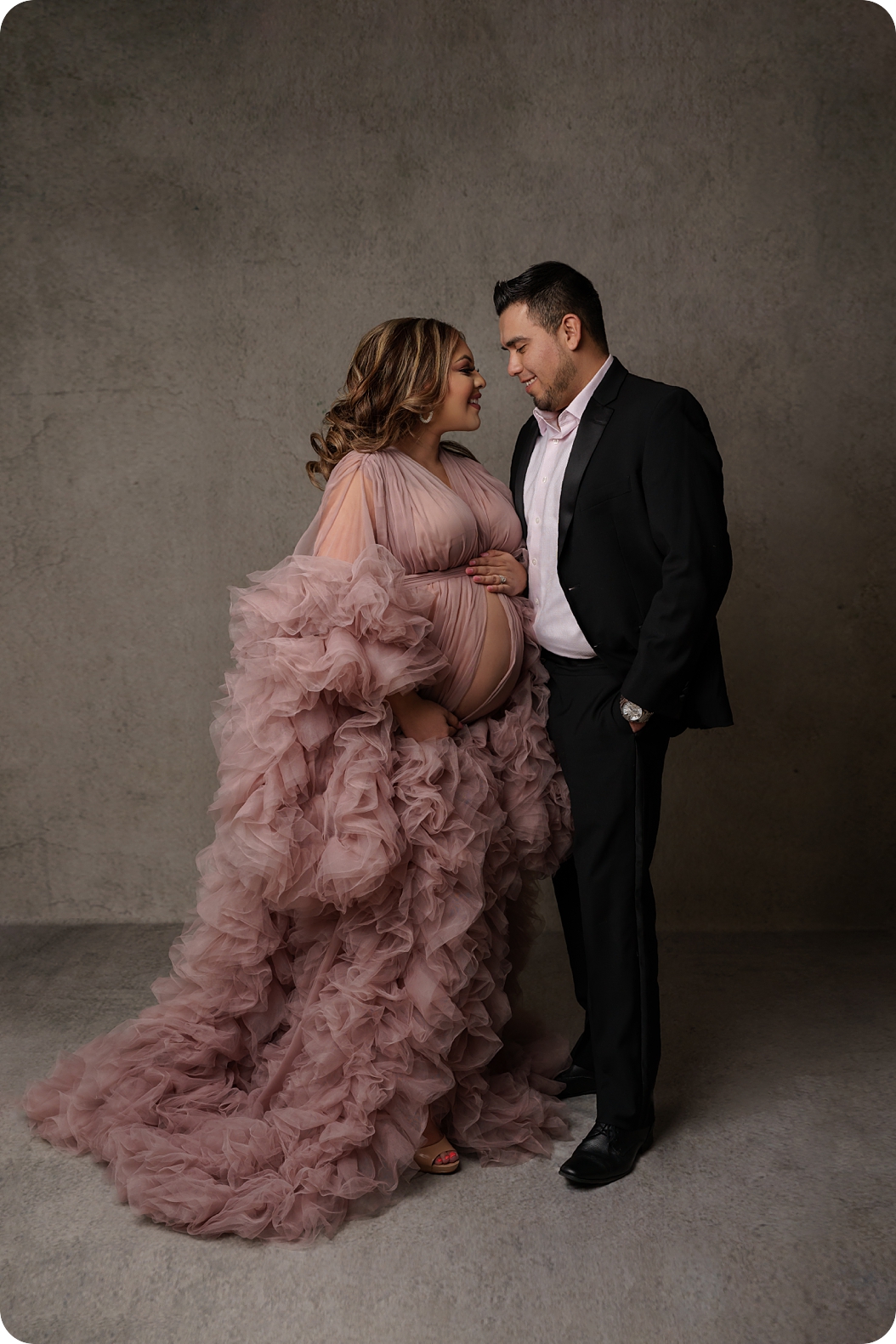 parents pose during studio maternity portraits in Utah 