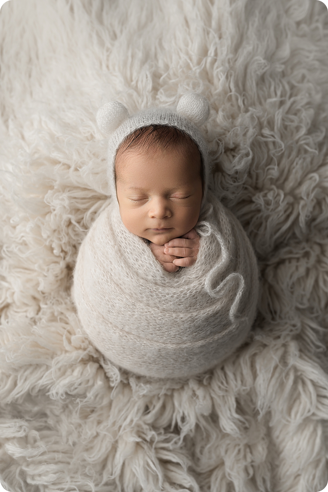 baby sleeps during newborn photos in Utah studio