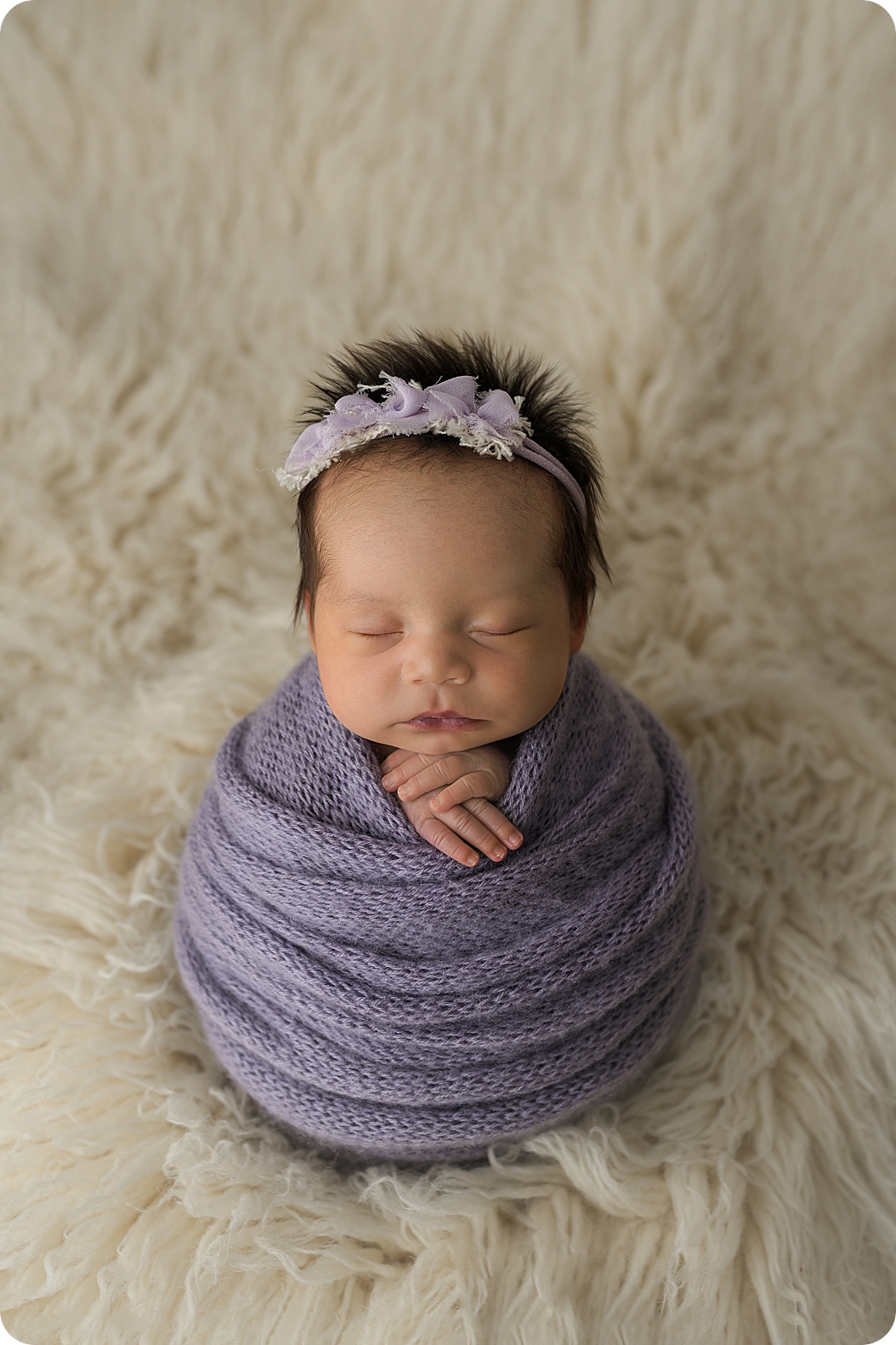 baby in purple wrap sleeps through Utah Newborn Session