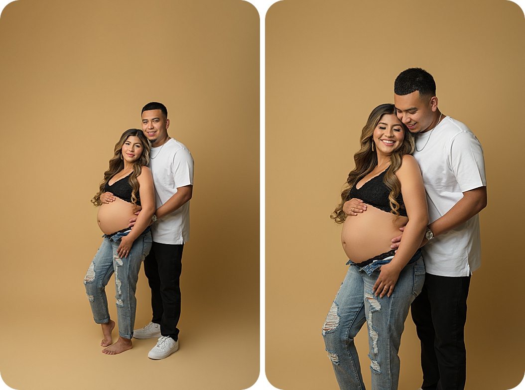 expecting parents pose in studio during studio maternity session