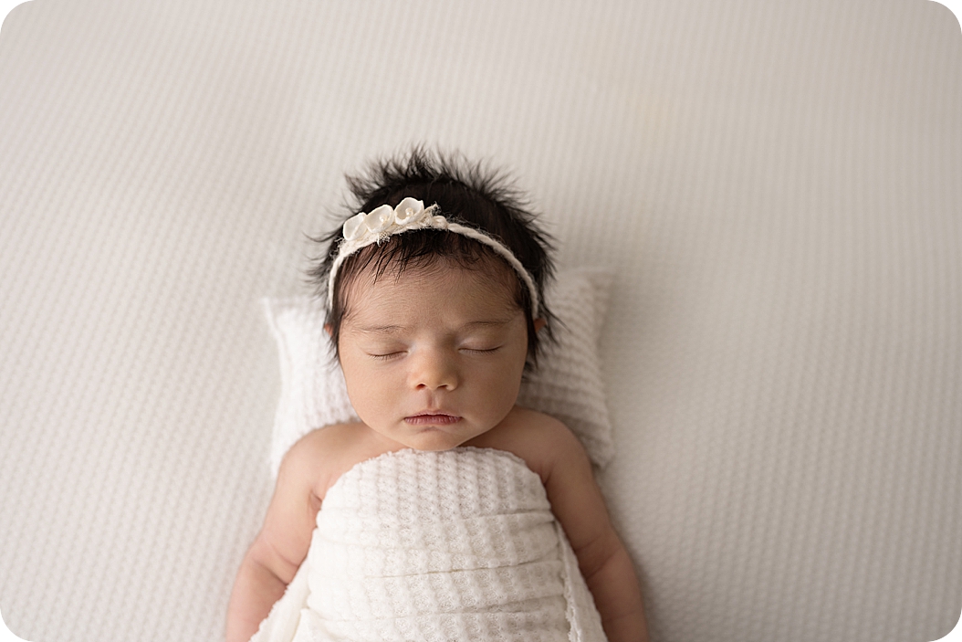baby sleeps during newborn session in Utah studio