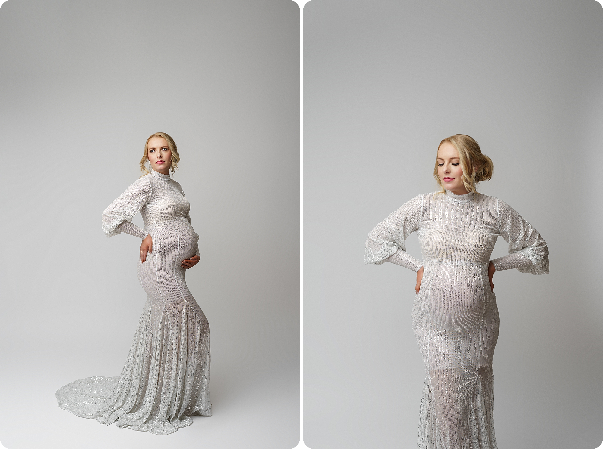 woman in white gown with holiday hair piece holds stomach during studio maternity portraits